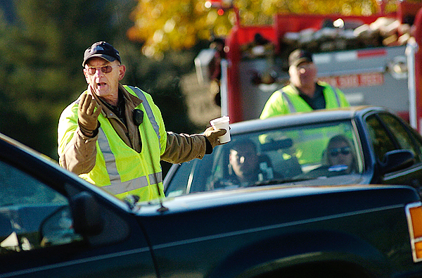 Fire Chief Tim Terry and Lt. El-win Boynton (background) of the Prospect Fire Department redi-rected traffic from a roadblock on Route 1A to Hawes Bridge Road in Prospect while state and local police searched for Randall Ho-fland who remained at large Fri-day morning. Brandishing a fire-arm and making threats to officers, Hofland fled the scene of a routine vehicle safety check on Route 1 in Searsport late Thurs-day night. Buy Photo Fire Chief Tim Terry and Lt. El-win Boynton (background) of the Prospect Fire Department redi-rected traffic from a roadblock on Route 1A to Hawes Bridge Road in Prospect while state and local police searched for Randall Ho-fland who remained at large Fri-day morning. Brandishing a fire-arm and making threats to officers, Hofland fled the scene of a routine vehicle safety check on Route 1 in Searsport late Thurs-day night. Buy Photo