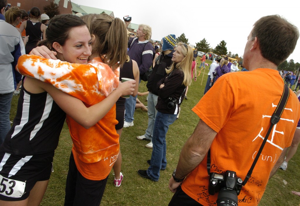 Michelle Haluska (far left) hugs Brewer High teammate Mikaela King after Haluska took fourth place, helping the Witches win the team title in the Eastern Maine Regional girls Class A Cross Country Championships at Troy Howard Middle School in Belfast on Saturday. Michelle Haluska (far left) hugs Brewer High teammate Mikaela King after Haluska took fourth place, helping the Witches win the team title in the Eastern Maine Regional girls Class A Cross Country Championships at Troy Howard Middle School in Belfast on Saturday.