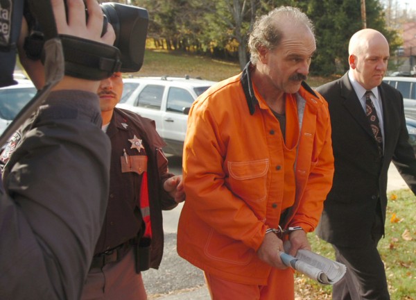 Randall Hofland (left), 55, of Searsport is led into Belfast District Court by Waldo County Jail Administrator Jason Trundy on Monday. After evading police for a week in connection to brandishing a firearm during a traffic stop, Hofland allegedly took 11 fifth-grade students hostage at Stockton Springs Elementary School on Friday, before he was tackled by police and taken into custody. Buy Photo Randall Hofland (left), 55, of Searsport is led into Belfast District Court by Waldo County Jail Administrator Jason Trundy on Monday. After evading police for a week in connection to brandishing a firearm during a traffic stop, Hofland allegedly took 11 fifth-grade students hostage at Stockton Springs Elementary School on Friday, before he was tackled by police and taken into custody. Buy Photo
