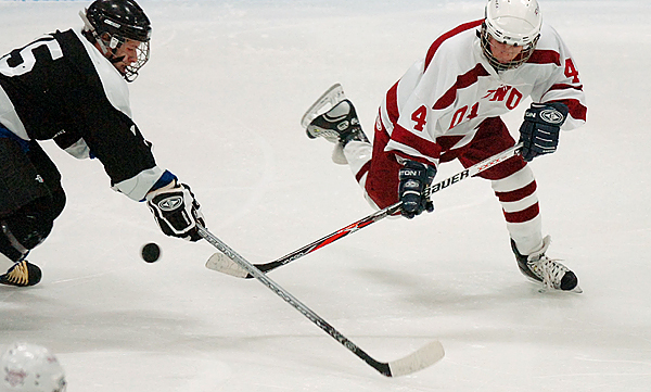 Orono freshman Dan Perry (right) sweeps the puck away from Houlton-Hodgdon sophomore Dylan Gard (left) in the second period of Saturday's game at Alfond Arena in Orono. Buy Photo Orono freshman Dan Perry (right) sweeps the puck away from Houlton-Hodgdon sophomore Dylan Gard (left) in the second period of Saturday's game at Alfond Arena in Orono. Buy Photo