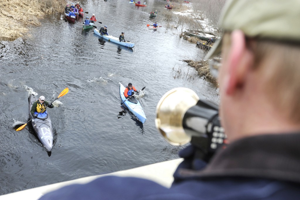 Race volunteer Jeff Rauch (foreground) of Belfast gets on the megaphone to stagger start two kayakers in the St. George River Race in Searsmont on Saturday morning. There were 107 boats in the water for the six-mile race that marks the start of the local paddle race season. Buy Photo Race volunteer Jeff Rauch (foreground) of Belfast gets on the megaphone to stagger start two kayakers in the St. George River Race in Searsmont on Saturday morning. There were 107 boats in the water for the six-mile race that marks the start of the local paddle race season. Buy Photo