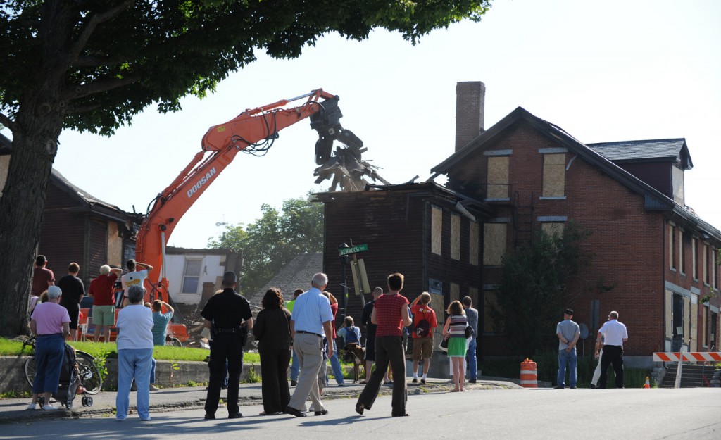 A crowd gathers at the intersection of Bennoch Road and Forest Ave. in Orono on Tuesday, August 4, 2009 to watch the demolition of the historic Katahdin Building located at 6 Bennoch Road. Fire damage from a June 9, 2009 fire damaged the building beyond repair. (Bangor Daily News/Kevin Bennett) A crowd gathers at the intersection of Bennoch Road and Forest Ave. in Orono on Tuesday, August 4, 2009 to watch the demolition of the historic Katahdin Building located at 6 Bennoch Road. Fire damage from a June 9, 2009 fire damaged the building beyond repair. (Bangor Daily News/Kevin Bennett)