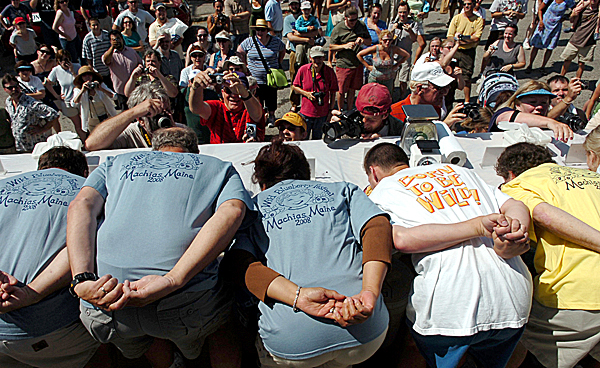 With their hands clasped behind their backs and their faces buried deep in blueberry pies, competitors are cheered on by the crowd during the Blueberry Pie Eating Contest on Saturday, August 15, 2009, at the Machias Wild Blueberry Festival. While the festival also includes music, vendors, and a five mile road race, the pie eating contest is so popular that contestants are chosen using a lottery system. (Bangor Daily News/Kate Collins) With their hands clasped behind their backs and their faces buried deep in blueberry pies, competitors are cheered on by the crowd during the Blueberry Pie Eating Contest on Saturday, August 15, 2009, at the Machias Wild Blueberry Festival. While the festival also includes music, vendors, and a five mile road race, the pie eating contest is so popular that contestants are chosen using a lottery system. (Bangor Daily News/Kate Collins)