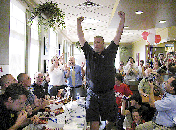 Justin Hills of Camden First Aid struts his stuff Thursday at the Rockland Tim Horton's after he won the law enforcement doughnut-eating challenge. The event is a fundraiser for Special Olympics of Maine. Buy Photo Justin Hills of Camden First Aid struts his stuff Thursday at the Rockland Tim Horton's after he won the law enforcement doughnut-eating challenge. The event is a fundraiser for Special Olympics of Maine. Buy Photo