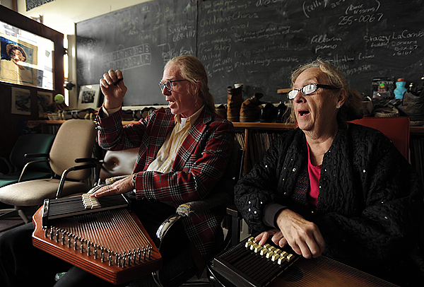 University of Maine at Machias music instructor Gene Nichols, left, gives an autoharp lesson to Marylena Graves, right, on Tuesday, September 22, 2009, in his music lab, which is filled with 25 years' worth of collecting music memorabilia, including shoes, ties, and musical instruments made from everyday items. (Bangor Daily News/Kevin Bennett) University of Maine at Machias music instructor Gene Nichols, left, gives an autoharp lesson to Marylena Graves, right, on Tuesday, September 22, 2009, in his music lab, which is filled with 25 years' worth of collecting music memorabilia, including shoes, ties, and musical instruments made from everyday items. (Bangor Daily News/Kevin Bennett)