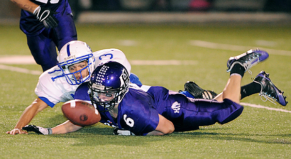 Hampden Academy's punter Justin Rodgerson (6) drops the ball as he was pressured by Bath's Everett Moye during the second quarter of the game in Hampden Friday evening. (Bangor Daily News/Gabor Degre) Hampden Academy's punter Justin Rodgerson (6) drops the ball as he was pressured by Bath's Everett Moye during the second quarter of the game in Hampden Friday evening. (Bangor Daily News/Gabor Degre)