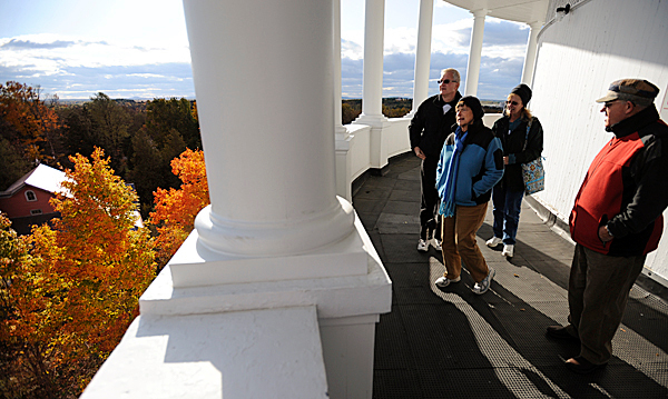 Jim Esuleman, left, and his wife, Marianne, second from right, of Mountain Top Penn. take in the fall colors from the Thomas Hill Standpipe while being guided on Wednesday, October 14, 2009 by friends, Chuck Geyer, right, and his wife Jane of Stuben, second from left. "They are fantasic" said Jim Esuleman of the view and colors surround the standpipe. (Bangor Daily News/Kevin Bennett) Jim Esuleman, left, and his wife, Marianne, second from right, of Mountain Top Penn. take in the fall colors from the Thomas Hill Standpipe while being guided on Wednesday, October 14, 2009 by friends, Chuck Geyer, right, and his wife Jane of Stuben, second from left. "They are fantasic" said Jim Esuleman of the view and colors surround the standpipe. (Bangor Daily News/Kevin Bennett)
