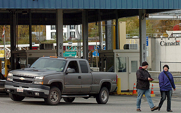German tourists Bernd and Monika Heumer cross the Ferry Point Bridge from St. Stephen to Calais on Monday, Oct. 19, 2009. The crossing was closed for seven hours the night before due to five people, possibly illegal immigrants, trying to cross on foot into the U.S. after leaving their vehicle on the Canadian side. U.S. authorities apprehended and questioned the five individuals. It is not known whether they have been released or not yet. (Bangor Daily News/Bridget Brown) German tourists Bernd and Monika Heumer cross the Ferry Point Bridge from St. Stephen to Calais on Monday, Oct. 19, 2009. The crossing was closed for seven hours the night before due to five people, possibly illegal immigrants, trying to cross on foot into the U.S. after leaving their vehicle on the Canadian side. U.S. authorities apprehended and questioned the five individuals. It is not known whether they have been released or not yet. (Bangor Daily News/Bridget Brown)