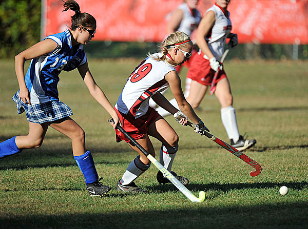 Dexter's Chelsea Crane, (29), works the ball into the offensive zone ahead of defender Ashley Rollins, (13), in the first period of their game in Dexter, Wed., Oct. 21, 2009. Bangor Daily NEws/Michael C. York Dexter's Chelsea Crane, (29), works the ball into the offensive zone ahead of defender Ashley Rollins, (13), in the first period of their game in Dexter, Wed., Oct. 21, 2009. Bangor Daily NEws/Michael C. York