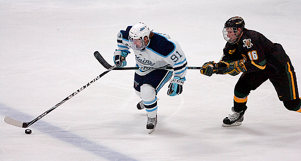 University of Maine's Klas Leidermark (91) tries to fend off the University of Vermont's Jay Anctil (16) who was penalized for hooking in the second period of Friday's game, Oct. 30, 2009 at the Alfond Arena in Orono. (Bangor Daily News/Bridget Brown) University of Maine's Klas Leidermark (91) tries to fend off the University of Vermont's Jay Anctil (16) who was penalized for hooking in the second period of Friday's game, Oct. 30, 2009 at the Alfond Arena in Orono. (Bangor Daily News/Bridget Brown)