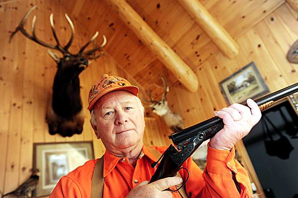 Art Wheaton holds an antique Parker 20-gauge shotgun in his home in Forest City on October 22, 2009. Wheaton, a retired vice president of Remington Arms and a Registered Maine Guide, continues a family tradition of taking hunters into the woods near his Forest City home and hunting camp. BANGOR DAILY NEWS PHOTO BY JOHN CLARKE RUSS Art Wheaton holds an antique Parker 20-gauge shotgun in his home in Forest City on October 22, 2009. Wheaton, a retired vice president of Remington Arms and a Registered Maine Guide, continues a family tradition of taking hunters into the woods near his Forest City home and hunting camp. BANGOR DAILY NEWS PHOTO BY JOHN CLARKE RUSS