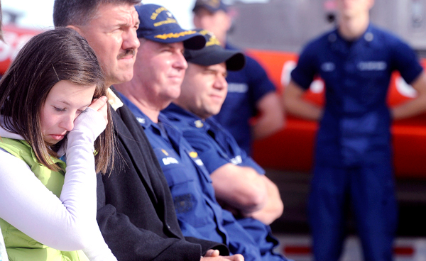 Twelve-year-old Simone Pelletier (left) of Belfast wipes away tears during a ceremony honoring members of the U.S. Coast Guard Friday in Southwest Harbor. The crews who participated in the rescue of people who were swept into the ocean by storm-driven wavesoff Mount Desert Island in late August received medals from the commandant of the United States Coast Guard Admiral Thad Allen. Pelletier was one of the seven people who were washed into the ocean and was later rescued by the Coast Guard. BANGOR DAILY NEWS PHOTO BY GABOR DEGRE Twelve-year-old Simone Pelletier (left) of Belfast wipes away tears during a ceremony honoring members of the U.S. Coast Guard Friday in Southwest Harbor. The crews who participated in the rescue of people who were swept into the ocean by storm-driven wavesoff Mount Desert Island in late August received medals from the commandant of the United States Coast Guard Admiral Thad Allen. Pelletier was one of the seven people who were washed into the ocean and was later rescued by the Coast Guard. BANGOR DAILY NEWS PHOTO BY GABOR DEGRE