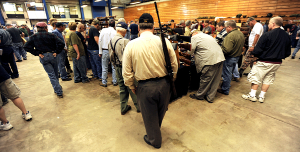 Most vendors tables at the Bangor Gun Show had gun enthusiast 2-3 deep waiting to see new or used guns or accessories being offered for sale or trade during the 2009 Bangor Gun Show at the Bangor Auditorium on Saturday, September 12, 2009. BANGOR DAILY NEWS PHOTO BY KEVIN BENNETT Most vendors tables at the Bangor Gun Show had gun enthusiast 2-3 deep waiting to see new or used guns or accessories being offered for sale or trade during the 2009 Bangor Gun Show at the Bangor Auditorium on Saturday, September 12, 2009. BANGOR DAILY NEWS PHOTO BY KEVIN BENNETT