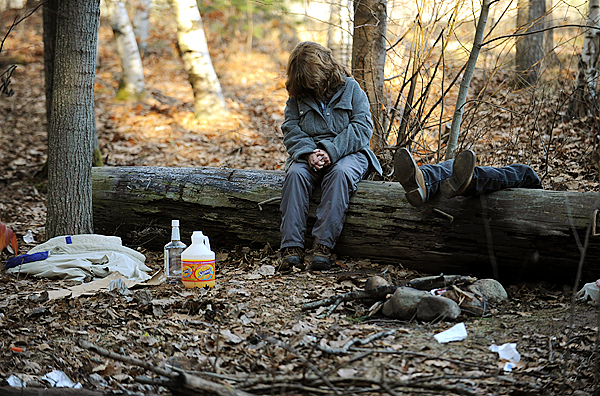 (BANGOR DAILY NEWS PHOTO BY KEVIN BENNETT)
CAPTION
A homeless woman slumps on a log after her male companion passed out while drinking at The Pines on Thursday, November 19, 2009. The Pines is a wooded area near the I-95 Hammond St. exit that is frequented by homeless people who live in make-shift campsites. It is also the site where Stephen James killed a fellow homeless man, Clyde Worster, in May of 2008. (Bangor Daily News/Kevin Bennett) (BANGOR DAILY NEWS PHOTO BY KEVIN BENNETT)
CAPTION
A homeless woman slumps on a log after her male companion passed out while drinking at The Pines on Thursday, November 19, 2009. The Pines is a wooded area near the I-95 Hammond St. exit that is frequented by homeless people who live in make-shift campsites. It is also the site where Stephen James killed a fellow homeless man, Clyde Worster, in May of 2008. (Bangor Daily News/Kevin Bennett)