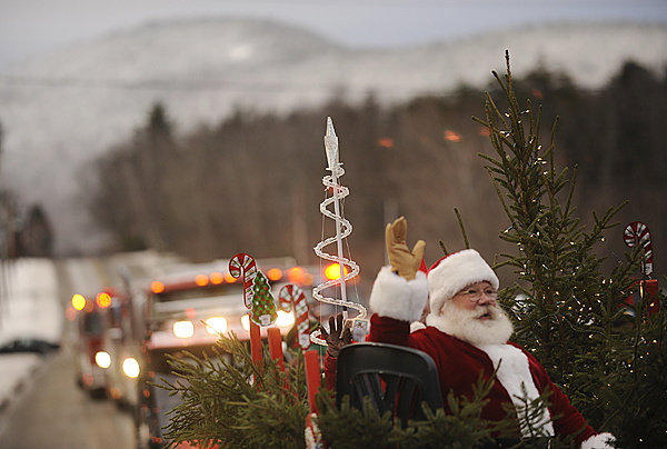 Playing the role of/ Filling in for Santa Claus, Rod Falla of Beaver Cove spreads his holiday cheer on the Moosehead ATV Riders float as the parade moves down Pritham Avenue during the Deck The Halls holiday events in Greenville, Maine Saturday, November 28, 2009. (Bangor Daily News) Playing the role of/ Filling in for Santa Claus, Rod Falla of Beaver Cove spreads his holiday cheer on the Moosehead ATV Riders float as the parade moves down Pritham Avenue during the Deck The Halls holiday events in Greenville, Maine Saturday, November 28, 2009. (Bangor Daily News)