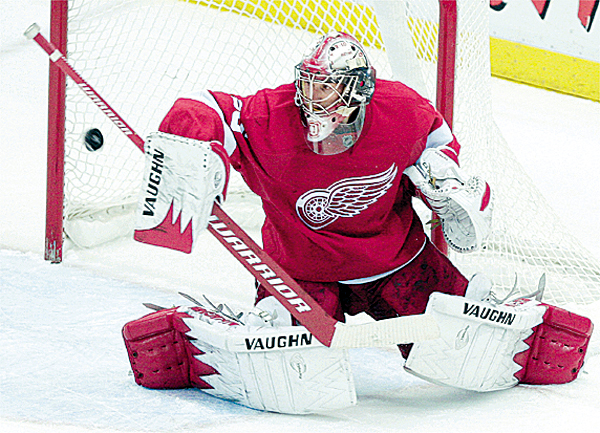 Detroit Red Wings goalie Jimmy Howard blocks a Phoenix Coyotes shot in the third period of an NHL hockey game in Detroit, Monday, Dec. 14, 2009. Detroit won 3-2. (AP Photo/Paul Sancya) Detroit Red Wings goalie Jimmy Howard blocks a Phoenix Coyotes shot in the third period of an NHL hockey game in Detroit, Monday, Dec. 14, 2009. Detroit won 3-2. (AP Photo/Paul Sancya)