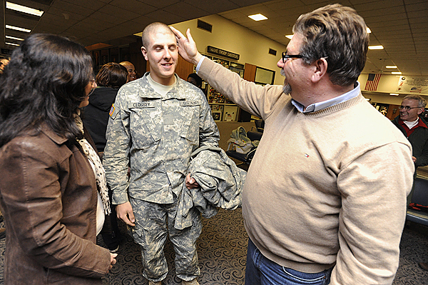 Harold Clossey of Robbinston runs his hand over the freshly shaven head of his son, Private First Class Zane Clossey,19, after the the younger Clossey's civilian flight arrived at Bangor International Airport early Saturday morning, December 19, 2009. On the left is his mom, Trish Hopkins, of St. Stephen, New Brunswick. The young Clossey just finished basic training and heads to Fort Hood after visiting his family on both sides of the border over the holidays. BANGOR DAILY NEWS PHOTO BY JOHN CLARKE RUSS Harold Clossey of Robbinston runs his hand over the freshly shaven head of his son, Private First Class Zane Clossey,19, after the the younger Clossey's civilian flight arrived at Bangor International Airport early Saturday morning, December 19, 2009. On the left is his mom, Trish Hopkins, of St. Stephen, New Brunswick. The young Clossey just finished basic training and heads to Fort Hood after visiting his family on both sides of the border over the holidays. BANGOR DAILY NEWS PHOTO BY JOHN CLARKE RUSS