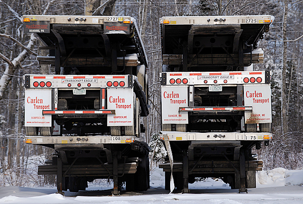 Stacked flatbed trailers sit behind Carlen Transport's Mecaw Road offices in Hampden on Tuesday, December 29, 2009. Lenny Peters has announced the closing of Carlen Transport, which will put 100 workers out of jobs. BANGOR DAILY NEWS PHOTO BY KEVIN BENNETT Stacked flatbed trailers sit behind Carlen Transport's Mecaw Road offices in Hampden on Tuesday, December 29, 2009. Lenny Peters has announced the closing of Carlen Transport, which will put 100 workers out of jobs. BANGOR DAILY NEWS PHOTO BY KEVIN BENNETT