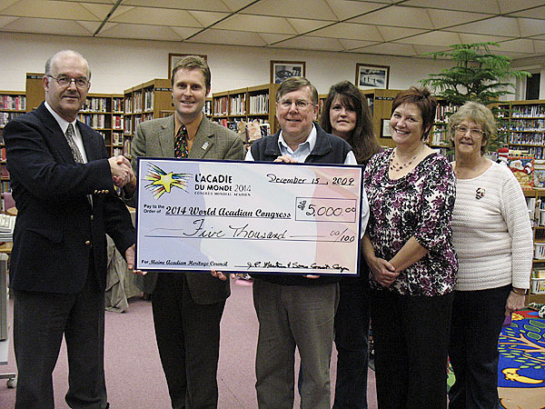 Van Buren: James Martin (left), president and founder of J.P. Martin and Sons Construction Corporation of Caribou, presents a check for $5,000 to representatives of the 2014 World Acadian Congress oversight board. Accepting the first private corporate donation from a firm in Maine that will go toward the event is (left to right) Jason Parent, Maine delegation president; Don Levesque, who serves as both a director from Maine and secretary of the 15 member board; and directors Louise Martin, Lise Pelletier and Anne Roy. PHOTO COURTESY OF JASON PARENT Van Buren: James Martin (left), president and founder of J.P. Martin and Sons Construction Corporation of Caribou, presents a check for $5,000 to representatives of the 2014 World Acadian Congress oversight board. Accepting the first private corporate donation from a firm in Maine that will go toward the event is (left to right) Jason Parent, Maine delegation president; Don Levesque, who serves as both a director from Maine and secretary of the 15 member board; and directors Louise Martin, Lise Pelletier and Anne Roy. PHOTO COURTESY OF JASON PARENT