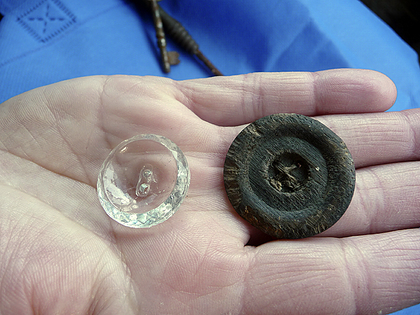 Corey shows off glass and wooden buttons found in the Lubec storefront she is renovating. BANGOR DAILY NEWS PHOTO BY SHARON KILEY MACK Corey shows off glass and wooden buttons found in the Lubec storefront she is renovating. BANGOR DAILY NEWS PHOTO BY SHARON KILEY MACK