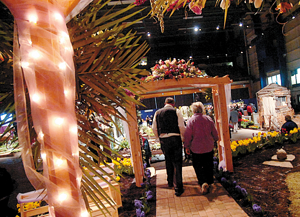 BANGOR GARDEN SHOW Visitors at the 17th annual Bangor Garden Show walk through a gazebo and arbor display Friday. Created by Black Bear Lawn Care and The Greenhouse, the Gazebo was part of the landscaper's exhibit. BANGOR DAILY NEWS FILE PHOTO BANGOR GARDEN SHOW Visitors at the 17th annual Bangor Garden Show walk through a gazebo and arbor display Friday. Created by Black Bear Lawn Care and The Greenhouse, the Gazebo was part of the landscaper's exhibit. BANGOR DAILY NEWS FILE PHOTO