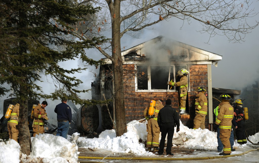 Firefighters from Stocton Springs, Prospect and Searsport inspect a mobile home at 43 Harris Road in Stockton Springs on Monday, Jan. 11, 2010. No one was home at the time the fire was reported. The State Fire Marshal's office has been called in to investigate further. (Bangor Daily News/Kevin Bennett) Firefighters from Stocton Springs, Prospect and Searsport inspect a mobile home at 43 Harris Road in Stockton Springs on Monday, Jan. 11, 2010. No one was home at the time the fire was reported. The State Fire Marshal's office has been called in to investigate further. (Bangor Daily News/Kevin Bennett)