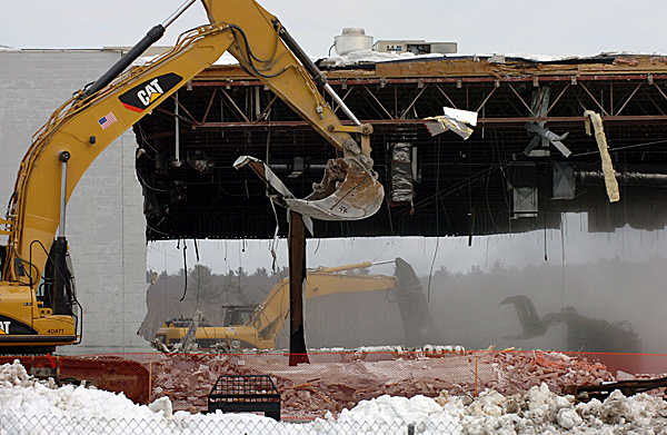 Demolition workers from Sargent Corporation tear down the former Walmart building on Springer Drive in Bangor on Monday, Jan. 11, 2010. The empty lot is expected to be used for a future Lowe's Home Improvement store. BANGOR DAILY NEWS PHOTO BY BRIDGET BROWN Demolition workers from Sargent Corporation tear down the former Walmart building on Springer Drive in Bangor on Monday, Jan. 11, 2010. The empty lot is expected to be used for a future Lowe's Home Improvement store. BANGOR DAILY NEWS PHOTO BY BRIDGET BROWN