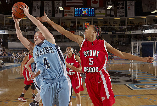 Maine's Kristin Baker, (4), keeps the ball away from Stony Brook's Gerda Gatling, (5), in the first half of their game in Orono , Sat., Jan. 16, 2010. BANGOR DAILY NEWS PHOTO BY MICHAEL C. YORK Maine's Kristin Baker, (4), keeps the ball away from Stony Brook's Gerda Gatling, (5), in the first half of their game in Orono , Sat., Jan. 16, 2010. BANGOR DAILY NEWS PHOTO BY MICHAEL C. YORK