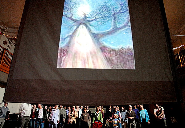 Participants watch a mulitmedia slide presentation of spiritual images at the start of the "The Cosmic Mass: Getting Back to the Garden" at Watts Hall in Thomaston Saturday evening, April 26, 2008. The First Universalist Church of Rockland sponsored the event. BANGOR DAILY NEWS PHOTO BY JOHN CLARKE RUSS Participants watch a mulitmedia slide presentation of spiritual images at the start of the "The Cosmic Mass: Getting Back to the Garden" at Watts Hall in Thomaston Saturday evening, April 26, 2008. The First Universalist Church of Rockland sponsored the event. BANGOR DAILY NEWS PHOTO BY JOHN CLARKE RUSS