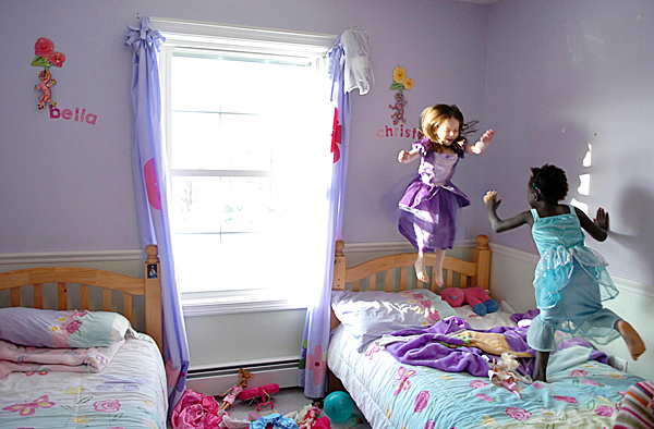 Sisters Bella, 4, (left) and Christella, 5, Logiodice play in their room Friday, Jan. 29, 2010 at their Pittsfield home. Their parents, Amanda and Jediah Logiodice, were united with their two adopted children from Haiti including Christella on Wednesday. Their mother recounted how after tucking the two girls into bed their first night, she discovered in the morning that Bella had crawled into bed with her new sister. BANGOR DAILY NEWS PHOTO BY BRIDGET BROWN Sisters Bella, 4, (left) and Christella, 5, Logiodice play in their room Friday, Jan. 29, 2010 at their Pittsfield home. Their parents, Amanda and Jediah Logiodice, were united with their two adopted children from Haiti including Christella on Wednesday. Their mother recounted how after tucking the two girls into bed their first night, she discovered in the morning that Bella had crawled into bed with her new sister. BANGOR DAILY NEWS PHOTO BY BRIDGET BROWN