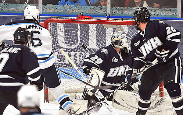 Maine's Jeff Dimmen, (6), watches his shot go under the crossbar over UNH goalie Brian Foster, (29), in the last minute of the second period of their NCAA hockey game in Orono, Maine, Friday, Feb. 5, 2010. BANGOR DAILY NEWS PHOTO BY MICHAEL C. YORK Maine's Jeff Dimmen, (6), watches his shot go under the crossbar over UNH goalie Brian Foster, (29), in the last minute of the second period of their NCAA hockey game in Orono, Maine, Friday, Feb. 5, 2010. BANGOR DAILY NEWS PHOTO BY MICHAEL C. YORK