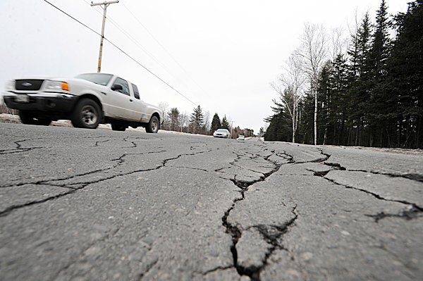 Traffic passes over rut and crack filled Route 15 in Abbott on Wednesday, Feb. 10, 2010. BANGOR DAILY NEWS PHOTO BY KEVIN BENNETT Traffic passes over rut and crack filled Route 15 in Abbott on Wednesday, Feb. 10, 2010. BANGOR DAILY NEWS PHOTO BY KEVIN BENNETT