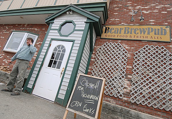 Jim Bence, new owner of the Bear Brew Pub in Orono, steps outside the pub to get better cell phone reception to talk with the pub's former owner Matt Haskell Wednesday afternoon, March 3, 2010. Bence said he hopes to re-open the pub and pizza oven in a few weeks with more renovations to come. (Bangor Daily News/John Clarke Russ) Jim Bence, new owner of the Bear Brew Pub in Orono, steps outside the pub to get better cell phone reception to talk with the pub's former owner Matt Haskell Wednesday afternoon, March 3, 2010. Bence said he hopes to re-open the pub and pizza oven in a few weeks with more renovations to come. (Bangor Daily News/John Clarke Russ)