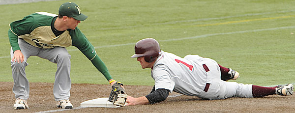 Husson's Barrett Dionne tags Bates runner Tom Beaton after Beaton tried to advance to third on a wild pitch during 3rd inning action of game one of a double header on Wednesday, March 24, 2010 at Husson University. Beaton was safe. BANGOR DAILY NEWS PHOTO BY KEVIN BENNETT Husson's Barrett Dionne tags Bates runner Tom Beaton after Beaton tried to advance to third on a wild pitch during 3rd inning action of game one of a double header on Wednesday, March 24, 2010 at Husson University. Beaton was safe. BANGOR DAILY NEWS PHOTO BY KEVIN BENNETT