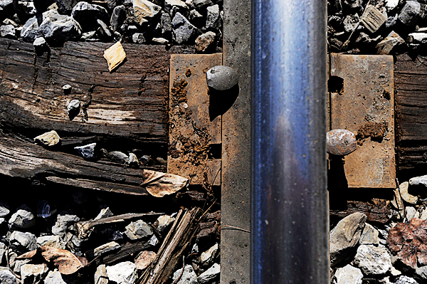 A splintered rail tie on a section of track of the Montreal, Maine and Atlantic railway in Masardis, Maine Thurdsday, March 18, 2010. Safety concerns and poor maintenance along sections of the MM&A railway in northern Maine limit the speed of their freight trains where 10 to 15 mph is common. State officials are seeking a $25 million bond to repair rail in Aroostook, Penobscot and Androscoggin counties. Without such aid railways like MM&A might have to abandon their 241 miles of track which remain crucial to Maine industries. BANGOR DAILY NEWS PHOTO BY JOHN CLARKE RUSS A splintered rail tie on a section of track of the Montreal, Maine and Atlantic railway in Masardis, Maine Thurdsday, March 18, 2010. Safety concerns and poor maintenance along sections of the MM&A railway in northern Maine limit the speed of their freight trains where 10 to 15 mph is common. State officials are seeking a $25 million bond to repair rail in Aroostook, Penobscot and Androscoggin counties. Without such aid railways like MM&A might have to abandon their 241 miles of track which remain crucial to Maine industries. BANGOR DAILY NEWS PHOTO BY JOHN CLARKE RUSS