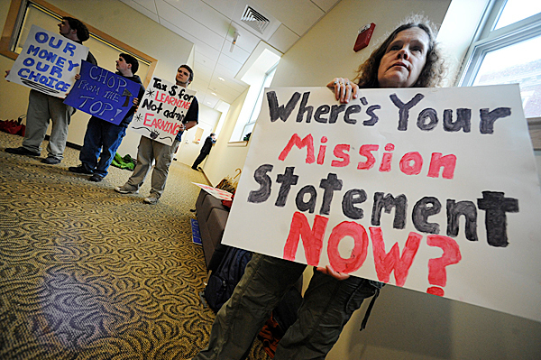 Julia Hathaway of Veazie joined students at Wells Commons in protesting the Academic Program Prioritization Working Group's recommendations during Monday's information forum there on U Maine's Orono campus. Hathaway's daughter, Amber Hathaway, a sophomore Women's Studies majo, might have her major cut in accord with working group's recommendations. "Without women's studies, we won't be able to take the steps necessary to achieve true gender equity, " said Julia Hathaway. BANGOR DAILY NEWS PHOTO BY JOHN CLARKE RUSS Julia Hathaway of Veazie joined students at Wells Commons in protesting the Academic Program Prioritization Working Group's recommendations during Monday's information forum there on U Maine's Orono campus. Hathaway's daughter, Amber Hathaway, a sophomore Women's Studies majo, might have her major cut in accord with working group's recommendations. "Without women's studies, we won't be able to take the steps necessary to achieve true gender equity, " said Julia Hathaway. BANGOR DAILY NEWS PHOTO BY JOHN CLARKE RUSS
