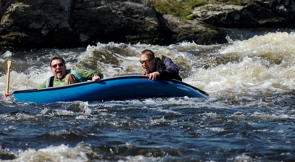 Dave Dube (left) of Glenburn and Kirk Winters of Levant take a tumble Wednesday afternoon, April 14, 2010 while negotiating Six Mile Falls on the Kenduskeag Stream in preparation for Saturday's race, which begins at 8 a.m. Both are pastors at The Rock Church in Bangor and are raising money, along with other church members, for First Step Pregnancy Resource Center through sponsorships for the race. "We got caught, it filled our boat in and we sunk," said Dube after the trial run. "Piece of cake," said Winters jokingly. (Bangor Daily News/Bridget Brown) Dave Dube (left) of Glenburn and Kirk Winters of Levant take a tumble Wednesday afternoon, April 14, 2010 while negotiating Six Mile Falls on the Kenduskeag Stream in preparation for Saturday's race, which begins at 8 a.m. Both are pastors at The Rock Church in Bangor and are raising money, along with other church members, for First Step Pregnancy Resource Center through sponsorships for the race. "We got caught, it filled our boat in and we sunk," said Dube after the trial run. "Piece of cake," said Winters jokingly. (Bangor Daily News/Bridget Brown)