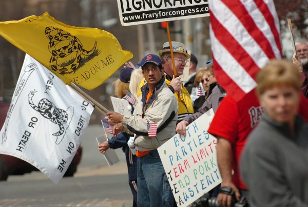 Tea party rally participants including Zarvin Shaffer of Guilford (center) gather on Harlow Street in downtown Bangor on Thursday, April 15, 2010 before walking to the Kenduskeag Stream and dumping in a handful of tea leaves. Similar rallies were replicated in various cities in Maine and throughout the country to coincide with federal income tax day. (Bangor Daily News/Bridget Brown) Tea party rally participants including Zarvin Shaffer of Guilford (center) gather on Harlow Street in downtown Bangor on Thursday, April 15, 2010 before walking to the Kenduskeag Stream and dumping in a handful of tea leaves. Similar rallies were replicated in various cities in Maine and throughout the country to coincide with federal income tax day. (Bangor Daily News/Bridget Brown)