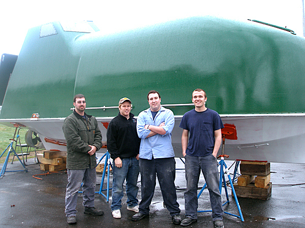 Student researchers Travis Wallace, a graduate student at the University of Maine, and Maine Maritime Academy seniors Christian Beauregard, Chris Wallace and Andrew Blackman, stand in front of the lifeboat they are converting so that they can capture waste heat from the boat's diesel engine and convert it to electrical power. They hope to complete the conversion in time to test it on the water before the end of this month. BANGOR DAILY NEWS PHOOT BY RICH HEWITT Student researchers Travis Wallace, a graduate student at the University of Maine, and Maine Maritime Academy seniors Christian Beauregard, Chris Wallace and Andrew Blackman, stand in front of the lifeboat they are converting so that they can capture waste heat from the boat's diesel engine and convert it to electrical power. They hope to complete the conversion in time to test it on the water before the end of this month. BANGOR DAILY NEWS PHOOT BY RICH HEWITT