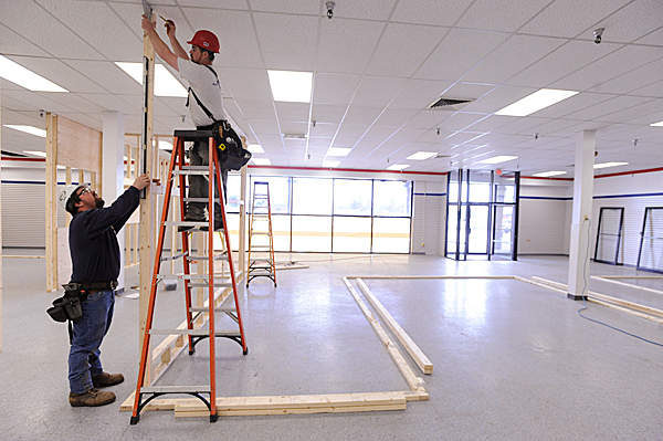 Carpenter Rob Turner (standing on ladder) and site superintendant Steve Dumais (cq), both with Augusta-based Ganneston Construction, checked the plumbness of interior wall studs as they and others worked on the interior of the new Bangor post office site in the vacant store front next to Hannford's at Broadway Shopping Center Tuesday, April 27 , 2010. They said work started there Monday, April 26, 2010 and is expected to be completed by Memorial Day weekend. BANGOR DAILY NEWS PHOTO BY JOHN CLARKE RUSS Carpenter Rob Turner (standing on ladder) and site superintendant Steve Dumais (cq), both with Augusta-based Ganneston Construction, checked the plumbness of interior wall studs as they and others worked on the interior of the new Bangor post office site in the vacant store front next to Hannford's at Broadway Shopping Center Tuesday, April 27 , 2010. They said work started there Monday, April 26, 2010 and is expected to be completed by Memorial Day weekend. BANGOR DAILY NEWS PHOTO BY JOHN CLARKE RUSS