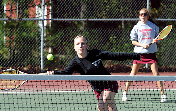 Bangor High School's Michaela Whitney (left) charges the net as her partner Adriana Capuano looks on during their 1st doubles match against Brewer High School's Tonya Carlson and Kim Thorne in Bangor Friday afternoon. Bangor won the match 6-1/6-1. BANGOR DAILY NEWS PHOTO BY GABOR DEGRE Bangor High School's Michaela Whitney (left) charges the net as her partner Adriana Capuano looks on during their 1st doubles match against Brewer High School's Tonya Carlson and Kim Thorne in Bangor Friday afternoon. Bangor won the match 6-1/6-1. BANGOR DAILY NEWS PHOTO BY GABOR DEGRE