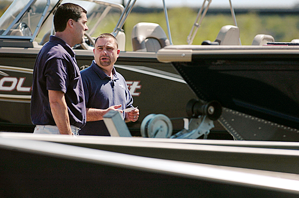 Hamlin's Marina sales manager Jason Richard talks to a potential customer Tuesday, May 11, 2010 at the business' new Bangor location at the intersection of Railroad and Summer Streets which opened this week. General manager Dan Higgins said the new location would focus on smaller boats, roughly 18 to 27-feet, which would include ski, fishing and pontoon boats among others. BANGOR DAILY NEWS PHOTO BY BRIDGET BROWN Hamlin's Marina sales manager Jason Richard talks to a potential customer Tuesday, May 11, 2010 at the business' new Bangor location at the intersection of Railroad and Summer Streets which opened this week. General manager Dan Higgins said the new location would focus on smaller boats, roughly 18 to 27-feet, which would include ski, fishing and pontoon boats among others. BANGOR DAILY NEWS PHOTO BY BRIDGET BROWN