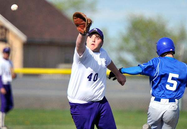 Travis Casey first baseman takes a high throw as CAHS's Dan Brewer reaches in the fourth inning. In field hit. BANGOR DAILY NEWS PHOTO BY MICHAEL C. YORK Travis Casey first baseman takes a high throw as CAHS's Dan Brewer reaches in the fourth inning. In field hit. BANGOR DAILY NEWS PHOTO BY MICHAEL C. YORK