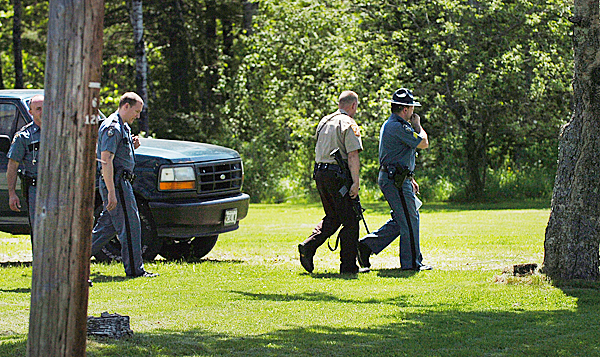 Law enforcement officials leave the residence of 327 Main Road in Passadumkeag on Sunday, May 23, 2010 where they responded to reports of a rifle being wielded against an Old Town mechanic who refused to leave the property. No one was charged in the incident and authorities determined that the firearm was not fired. BANGOR DAILY NEWS PHOTO BY BRIDGET BROWN Law enforcement officials leave the residence of 327 Main Road in Passadumkeag on Sunday, May 23, 2010 where they responded to reports of a rifle being wielded against an Old Town mechanic who refused to leave the property. No one was charged in the incident and authorities determined that the firearm was not fired. BANGOR DAILY NEWS PHOTO BY BRIDGET BROWN