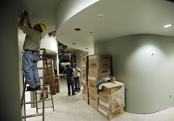 A worker installs lighting fixtures in a hallway of the new Penobscot Community Health Care facility at the former Wilson Square Mall on outer Wilson Street in Brewer on Thursday, June 3, 2010. BANGOR DAILY NEWS PHOTO BY KEVIN BENNETT A worker installs lighting fixtures in a hallway of the new Penobscot Community Health Care facility at the former Wilson Square Mall on outer Wilson Street in Brewer on Thursday, June 3, 2010. BANGOR DAILY NEWS PHOTO BY KEVIN BENNETT