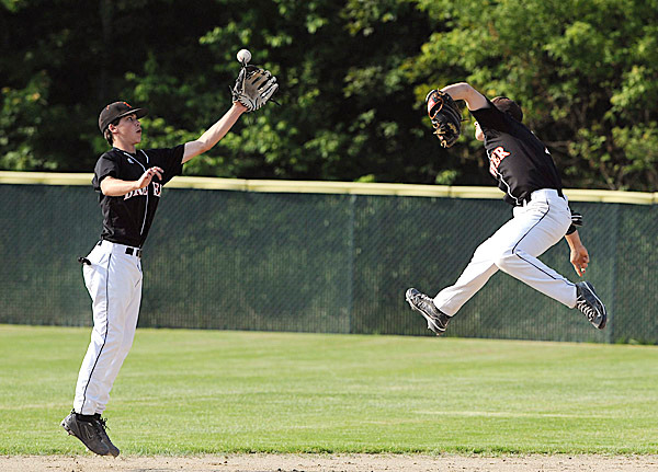 Brewer High School's #2 Jordan Smith (right) and #13 Tyler Libby both fail to make the catch at second base during the second inning of the Easter Maine Class A Baseball final game against Oxford Hills High School in Augusta Tuesday afternoon.
BANGOR DAILY NEWS PHOTO BY GABOR DEGRE Brewer High School's #2 Jordan Smith (right) and #13 Tyler Libby both fail to make the catch at second base during the second inning of the Easter Maine Class A Baseball final game against Oxford Hills High School in Augusta Tuesday afternoon.
BANGOR DAILY NEWS PHOTO BY GABOR DEGRE