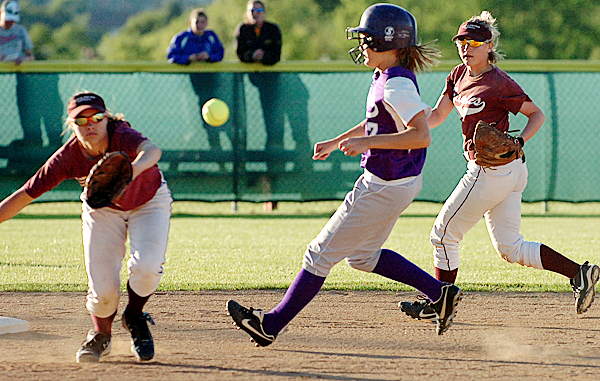 Woodland's Molly White (center) is chased to second base by George Stevens' Amber Gray (right) as short stop Richelle Kane (left) anticipates the throw in the first inning of Tuesday's Eastern Maine final, June 15, 2010 at Coffin Field in Brewer. BANGOR DAILY NEWS PHOTO BY BRIDGET BROWN Woodland's Molly White (center) is chased to second base by George Stevens' Amber Gray (right) as short stop Richelle Kane (left) anticipates the throw in the first inning of Tuesday's Eastern Maine final, June 15, 2010 at Coffin Field in Brewer. BANGOR DAILY NEWS PHOTO BY BRIDGET BROWN