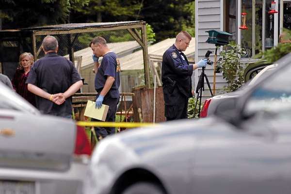 Maine State Police Evidence Response Team members collect evidence from a residence on U.S. Route 1 in Orient on Friday, July 2, 2010 in connection with last week's triple homicide. (Bangor Daily News/Bridget Brown) Maine State Police Evidence Response Team members collect evidence from a residence on U.S. Route 1 in Orient on Friday, July 2, 2010 in connection with last week's triple homicide. (Bangor Daily News/Bridget Brown)