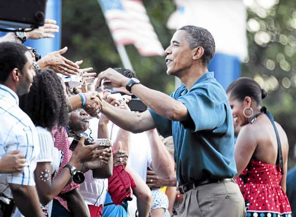 President Barack Obama, center, and first lady Michelle Obama, right, greet members of the United States Armed Forces and their families as they host an Independence Day celebration on the White House's South Lawn, Sunday, July 4, 2010 in Washington. (AP Photo/Manuel Balce Ceneta) President Barack Obama, center, and first lady Michelle Obama, right, greet members of the United States Armed Forces and their families as they host an Independence Day celebration on the White House's South Lawn, Sunday, July 4, 2010 in Washington. (AP Photo/Manuel Balce Ceneta)