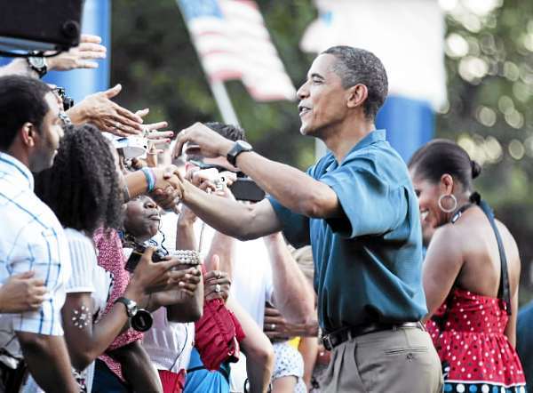 President Barack Obama, center, and first lady Michelle Obama, right, greet members of the United States Armed Forces and their families as they host an Independence Day celebration on the White House's South Lawn, Sunday, July 4, 2010 in Washington. (AP Photo/Manuel Balce Ceneta) President Barack Obama, center, and first lady Michelle Obama, right, greet members of the United States Armed Forces and their families as they host an Independence Day celebration on the White House's South Lawn, Sunday, July 4, 2010 in Washington. (AP Photo/Manuel Balce Ceneta)